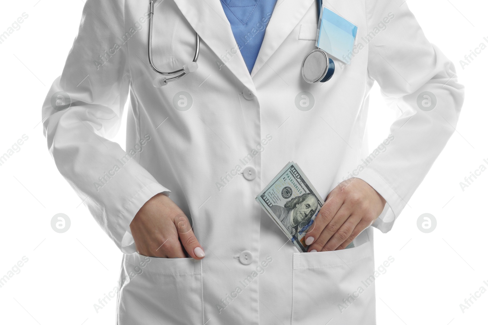 Photo of Corruption concept. Doctor putting dollar banknotes into her pocket on white background, closeup