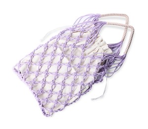 Photo of Handmade macrame shopping bag isolated on white, top view