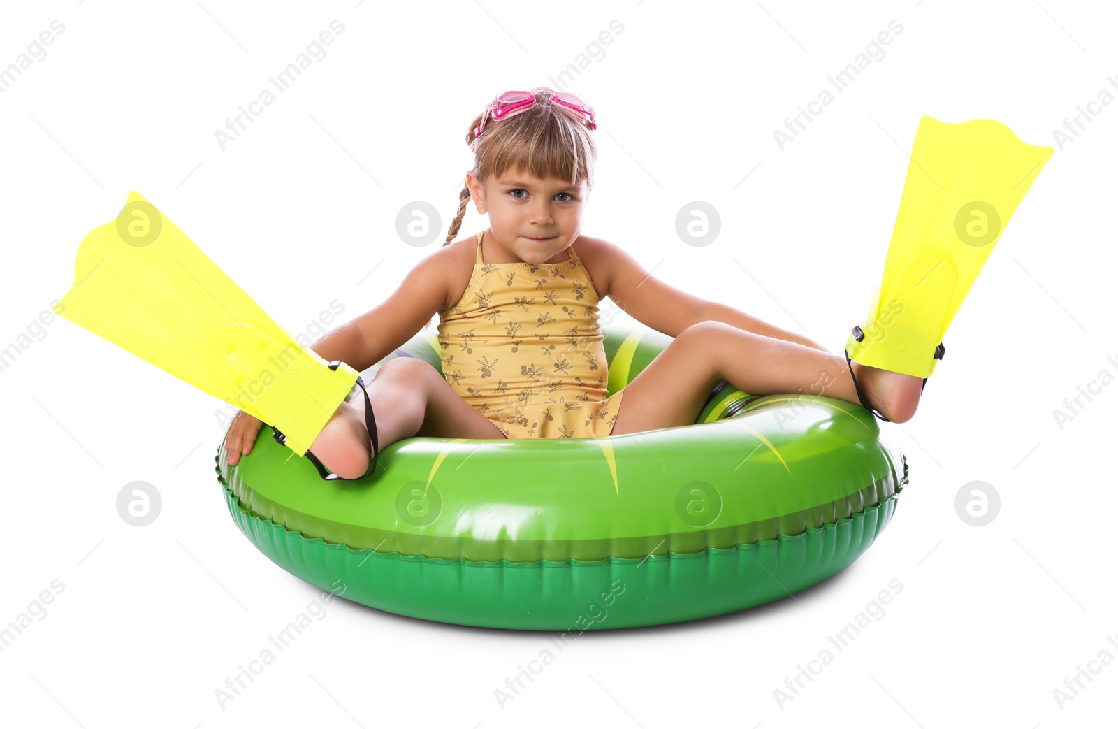 Photo of Cute little girl in swimsuit with inflatable ring, flippers and swim goggles on white background