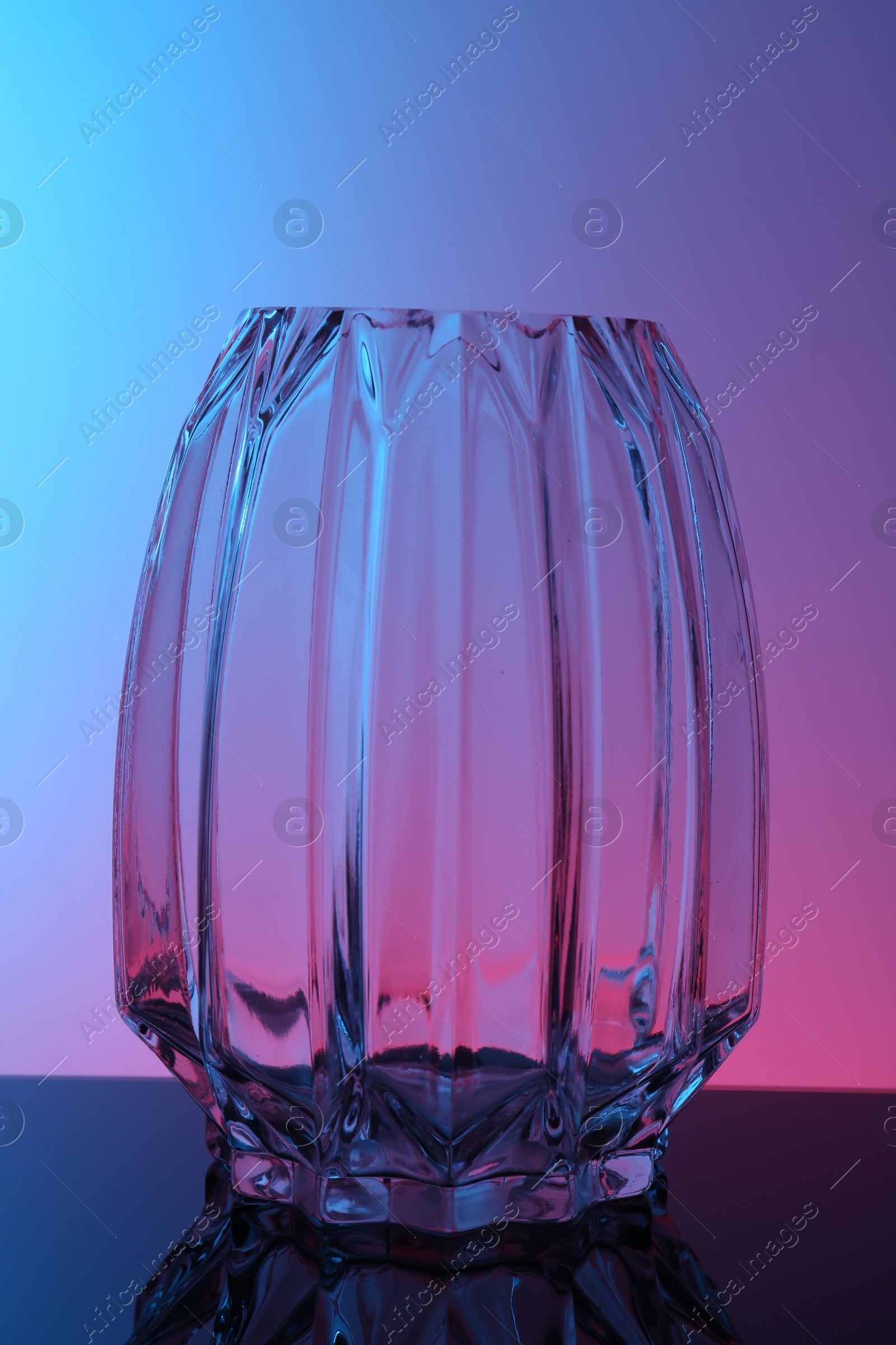 Photo of Empty glass vase on table, color tone effect