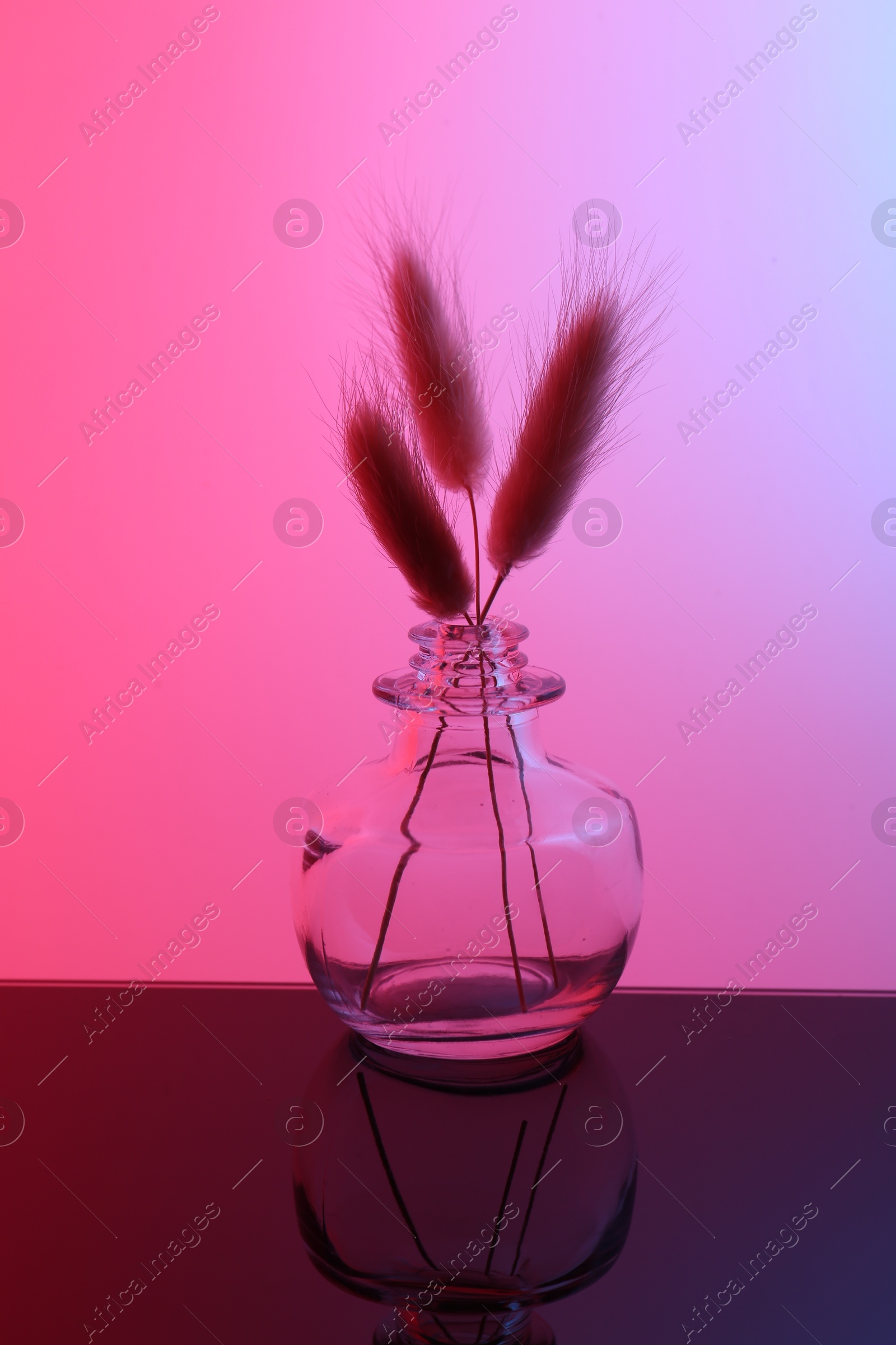 Photo of Glass vase with spikes on table, color tone effect