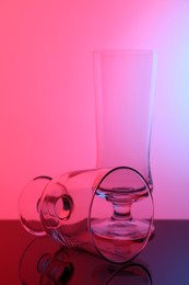 Photo of Empty glasses on table, color tone effect