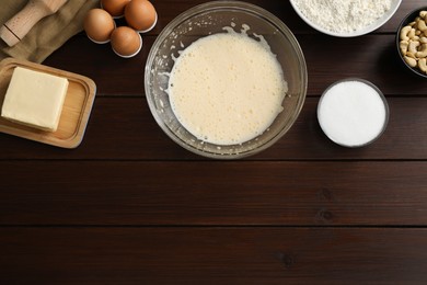 Photo of Different ingredients for cookies on wooden table, flat lay. Space for text