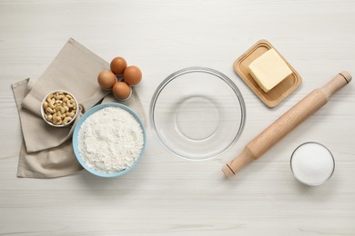 Photo of Different ingredients for cookies on white wooden table, flat lay