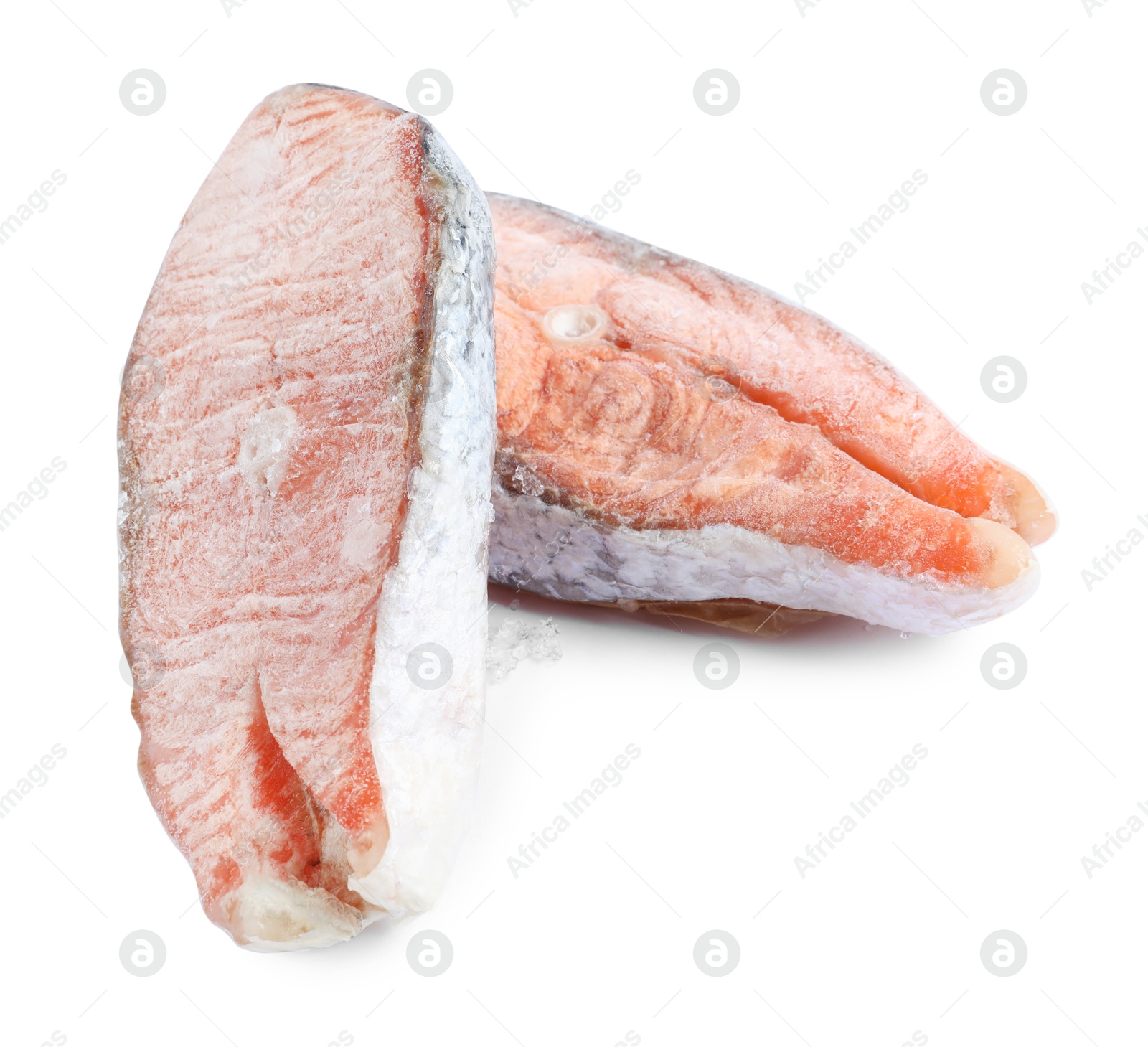 Photo of Two frozen salmon steaks isolated on white