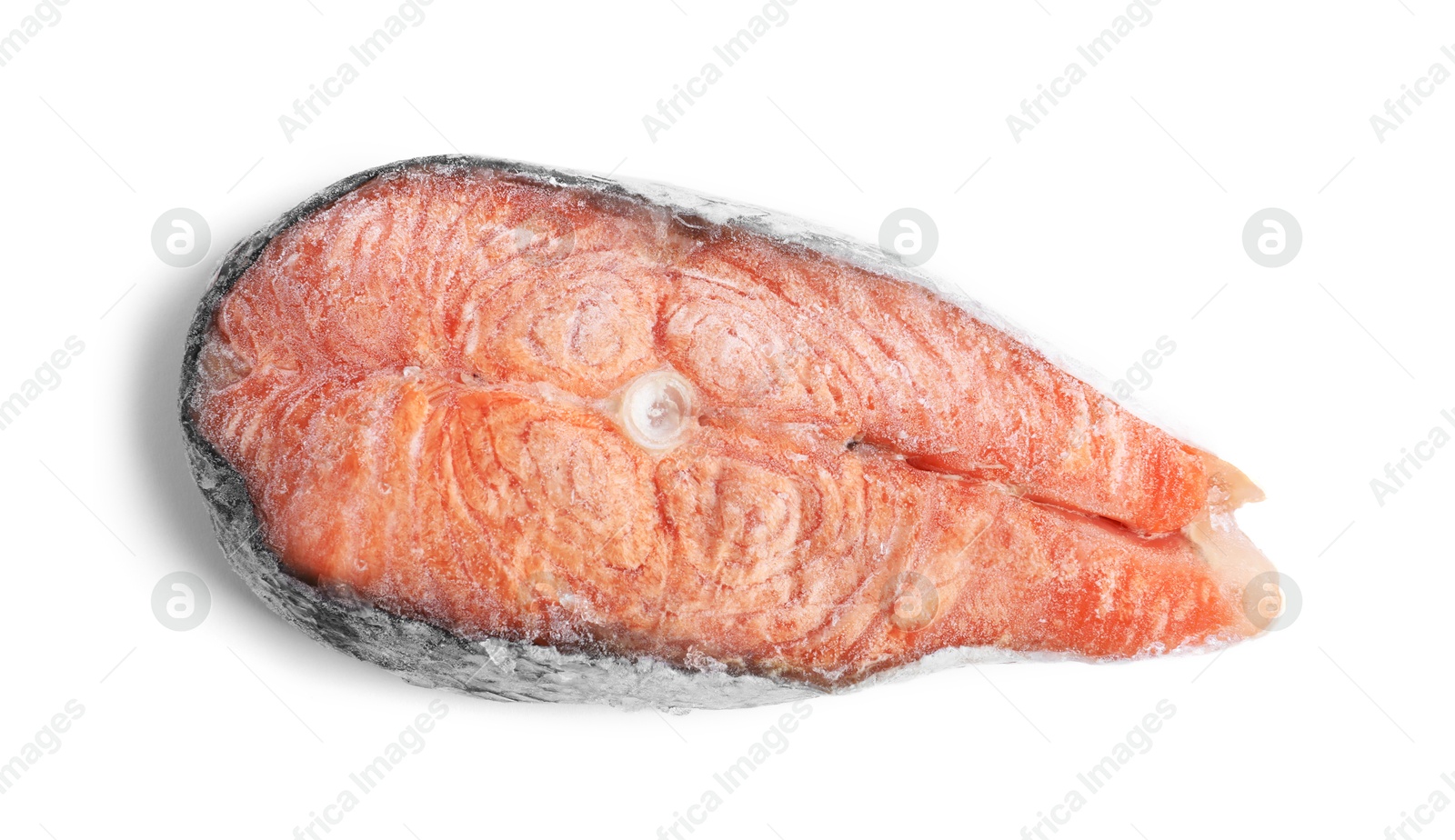 Photo of One frozen salmon steak isolated on white, top view