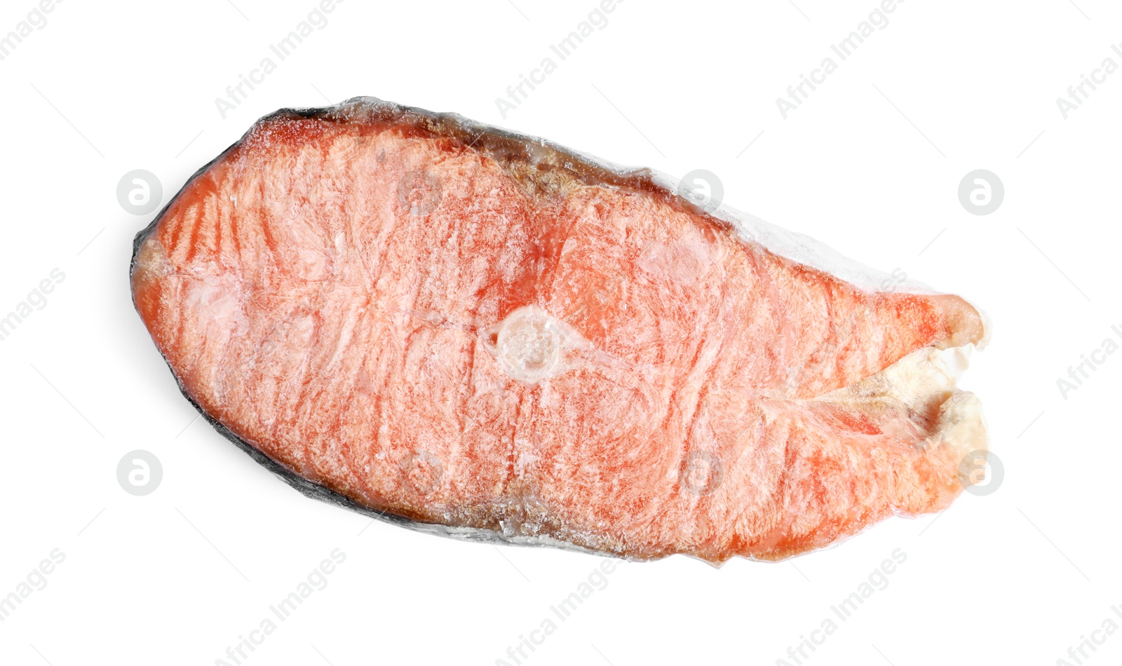 Photo of One frozen salmon steak isolated on white, top view