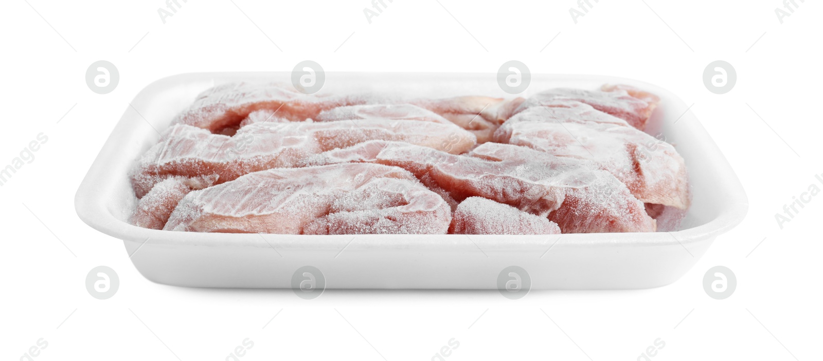 Photo of Frozen pieces of chicken fillet in container isolated on white