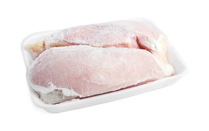 Photo of Frozen chicken breasts in container isolated on white