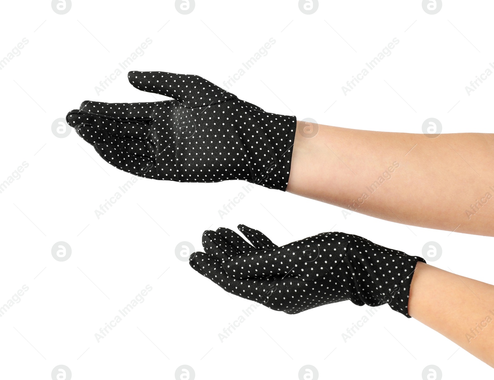 Photo of Woman in elegant polka dot gloves isolated on white, closeup