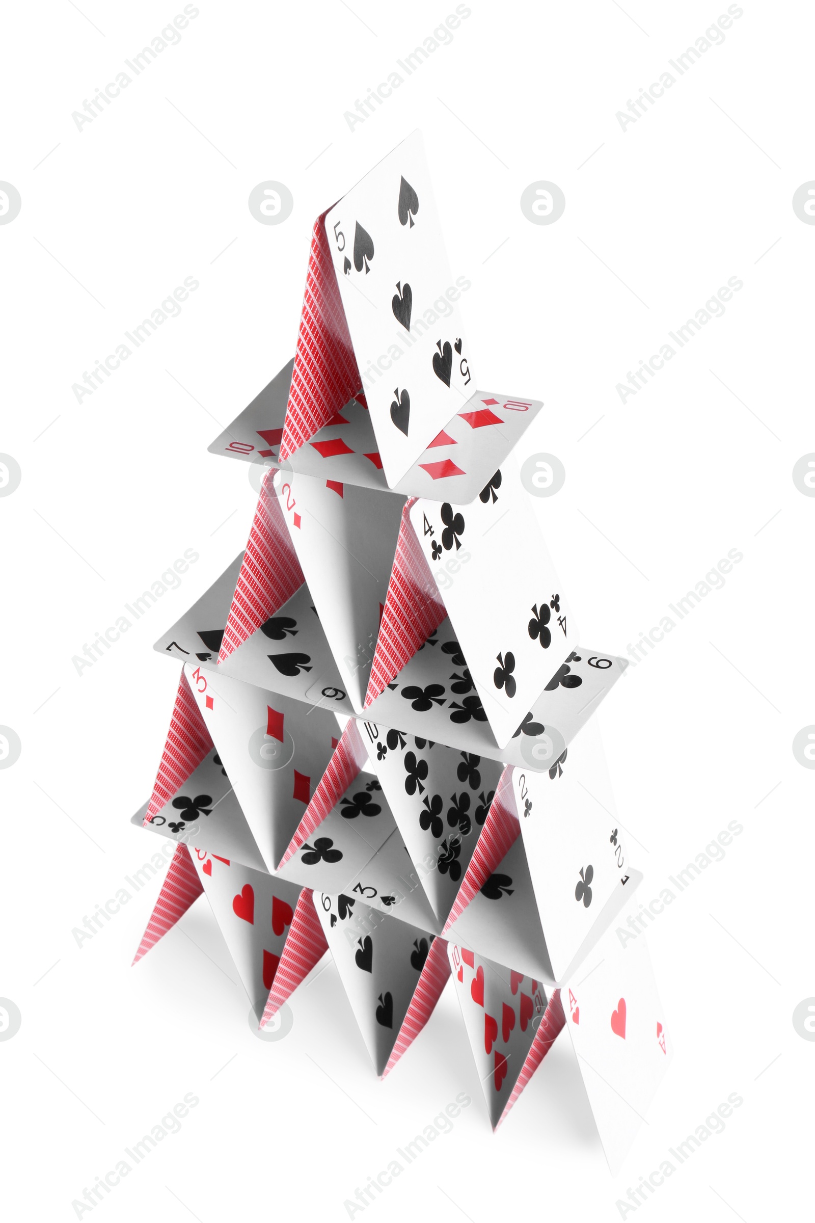 Photo of House of playing cards isolated on white