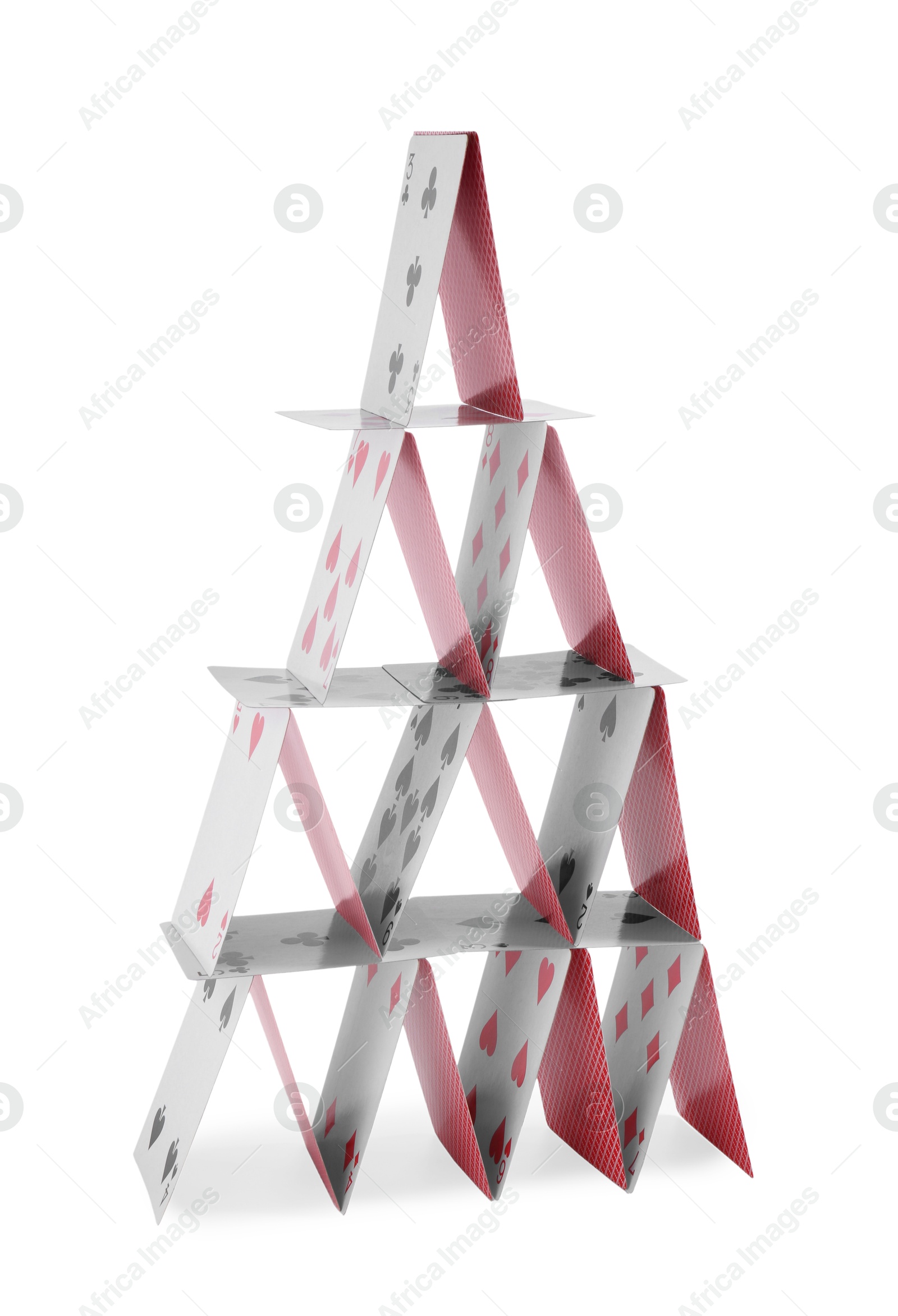 Photo of House of playing cards isolated on white