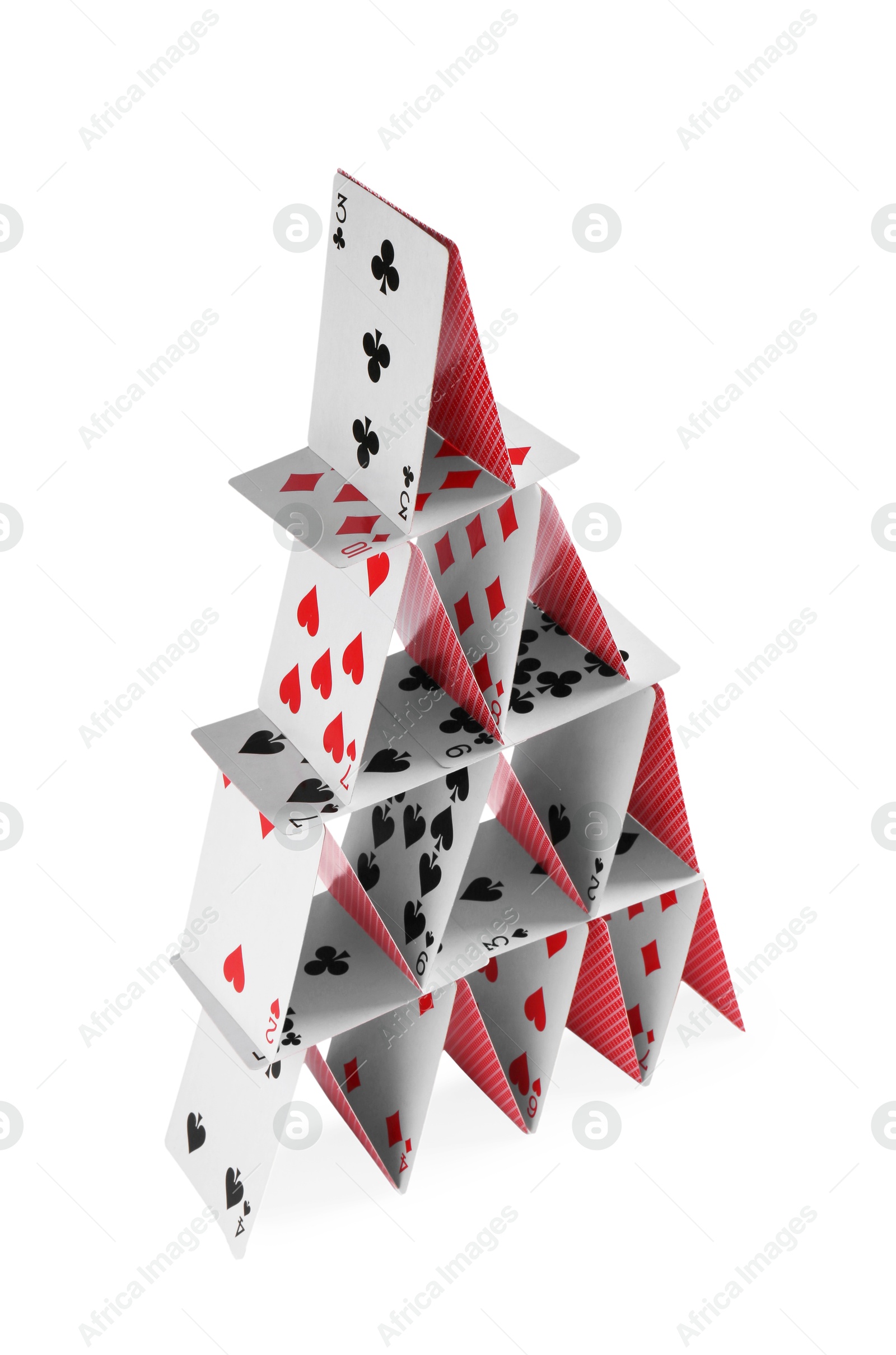 Photo of House of playing cards isolated on white