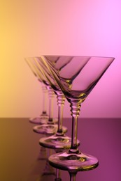 Photo of Empty glasses on table, color tone effect