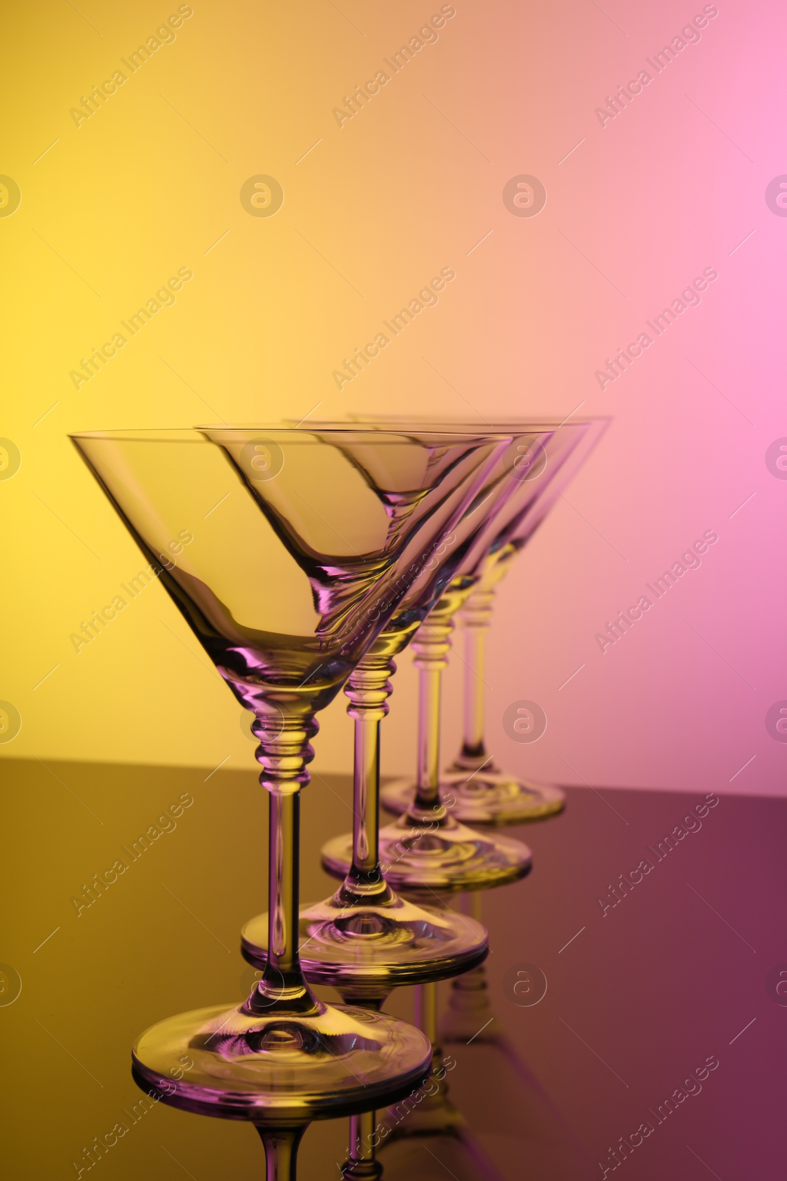 Photo of Empty glasses on table, color tone effect