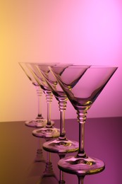 Photo of Empty glasses on table, color tone effect