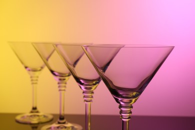 Photo of Empty glasses on table, color tone effect