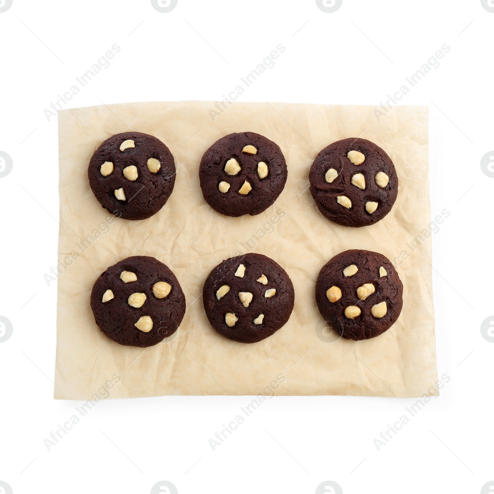 Photo of Tasty chocolate cookies with hazelnuts isolated on white, top view