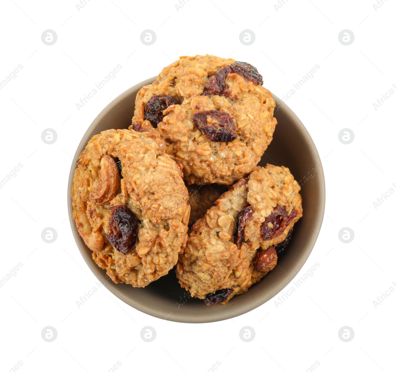 Photo of Delicious oatmeal cookies with dried cranberries and nuts in bowl isolated on white, top view