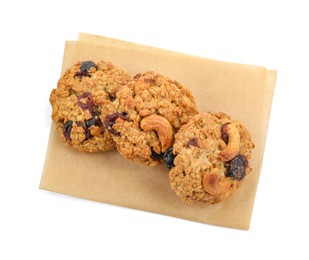 Photo of Delicious oatmeal cookies with dried cranberries and nuts isolated on white, top view