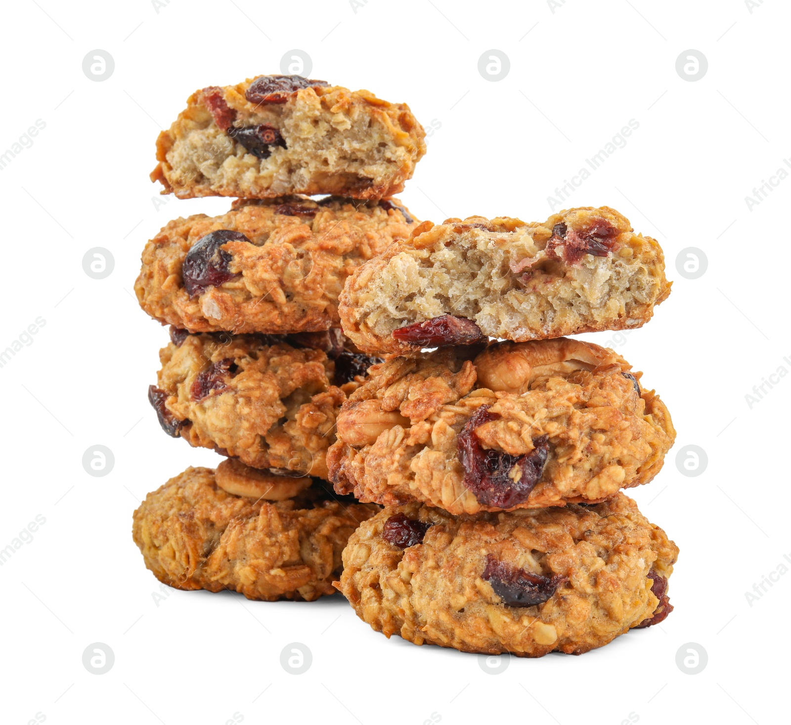 Photo of Stacks of delicious oatmeal cookies with dried cranberries and nuts isolated on white