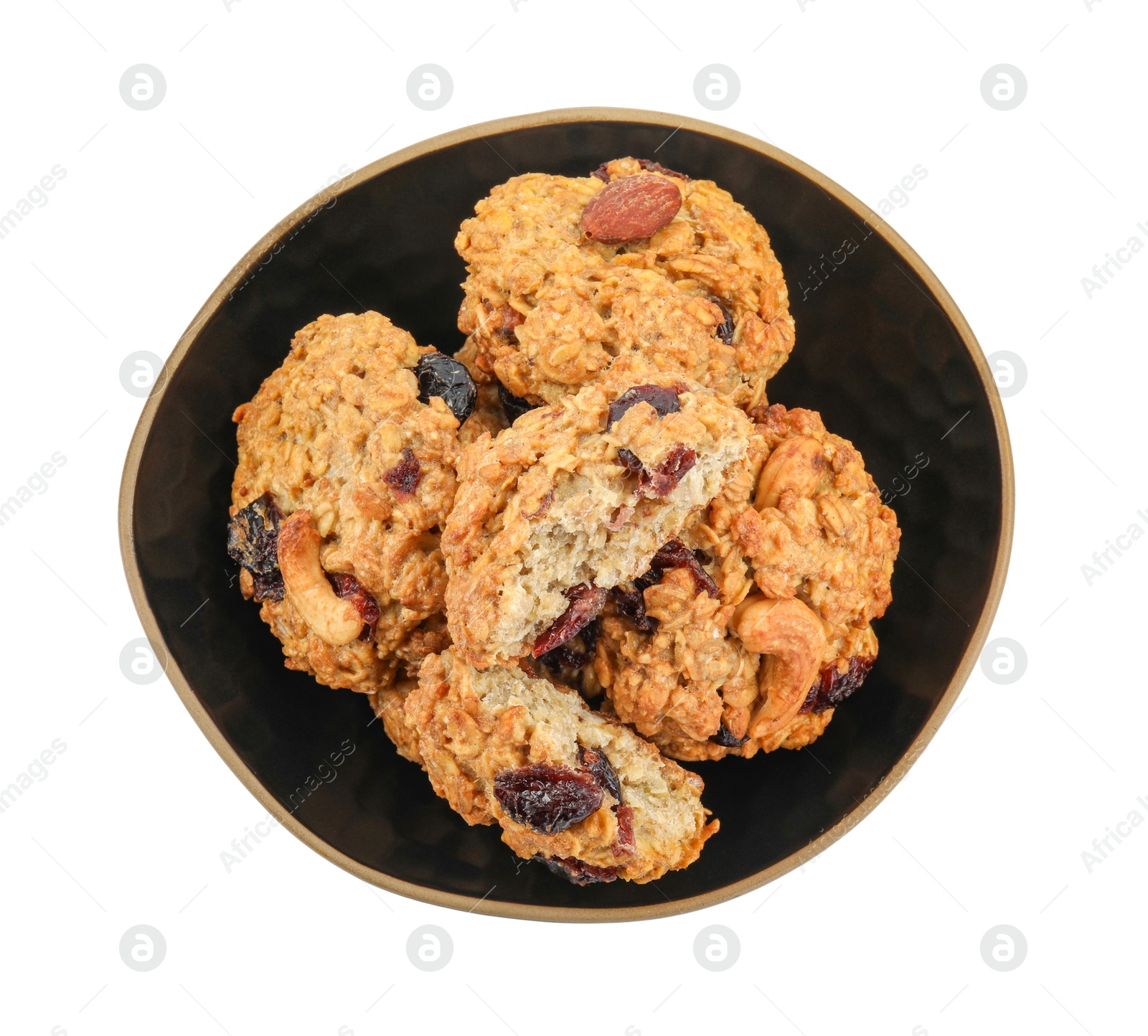 Photo of Delicious oatmeal cookies with dried cranberries and nuts in bowl isolated on white, top view