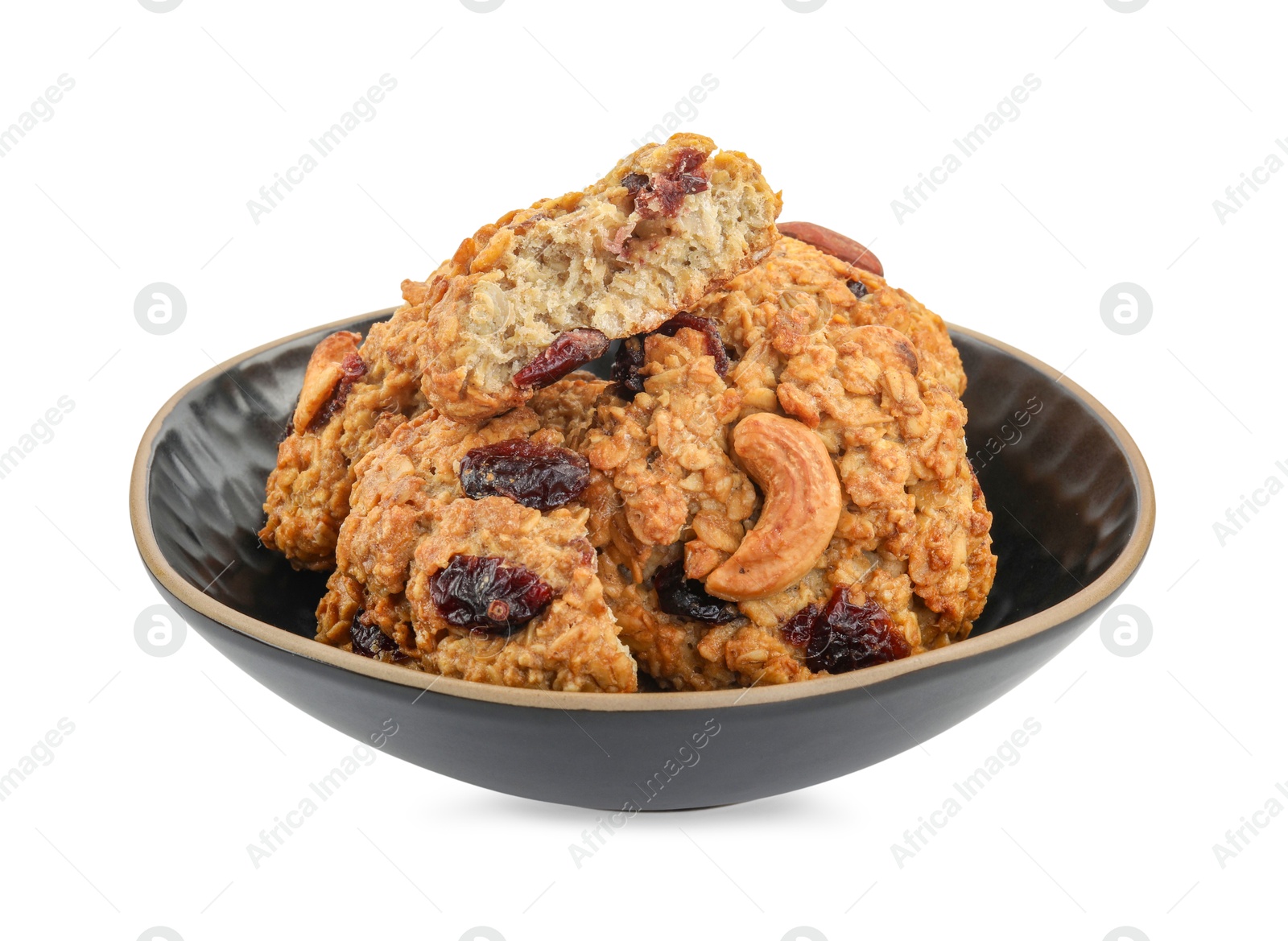 Photo of Delicious oatmeal cookies with dried cranberries and nuts in bowl isolated on white