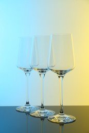 Photo of Empty glasses on table, color tone effect