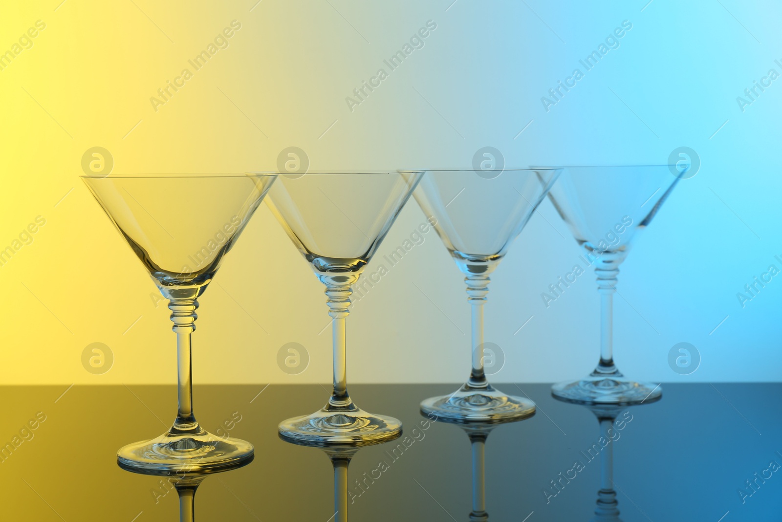 Photo of Empty glasses on table, color tone effect