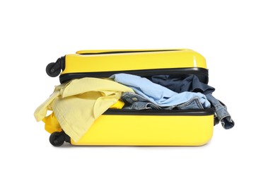 Photo of Packed suitcase full of clothes isolated on white