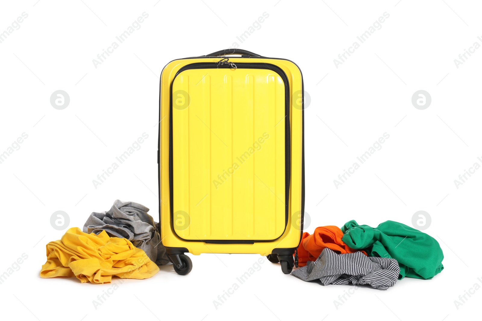 Photo of Suitcase and messy clothes isolated on white