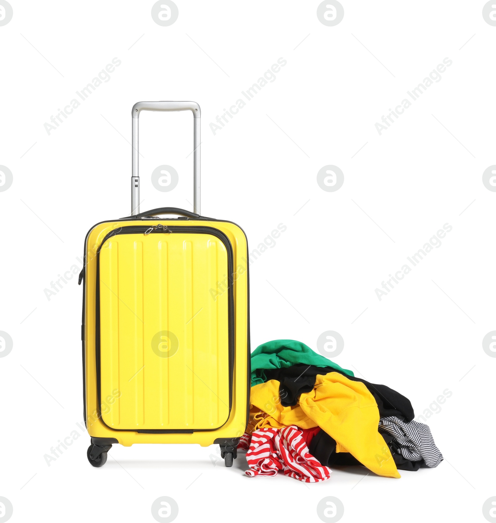 Suitcase and messy pile of clothes isolated on white Photo of Suitcase and messy pile of clothes isolated on white