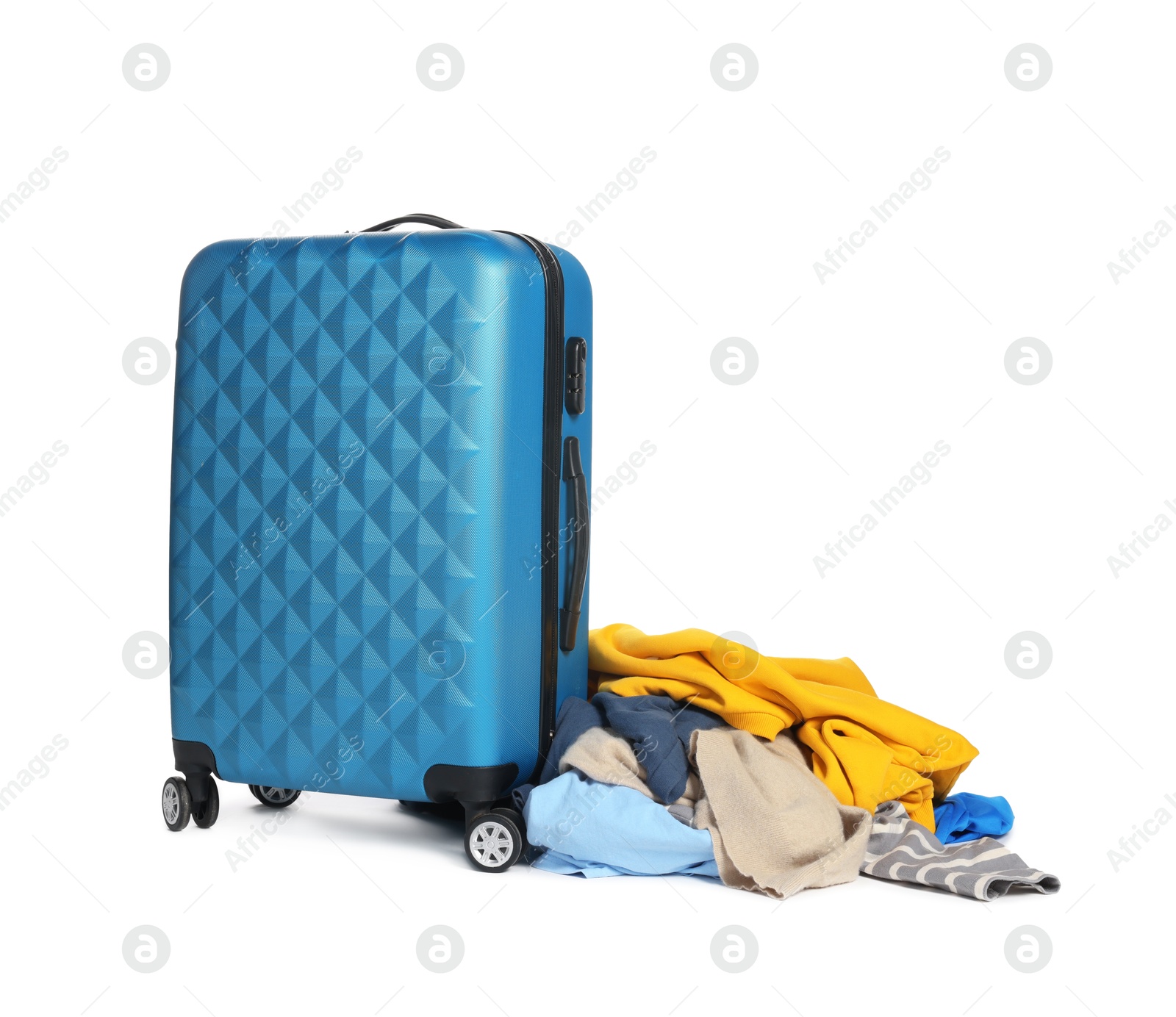 Photo of Suitcase and messy pile of clothes isolated on white