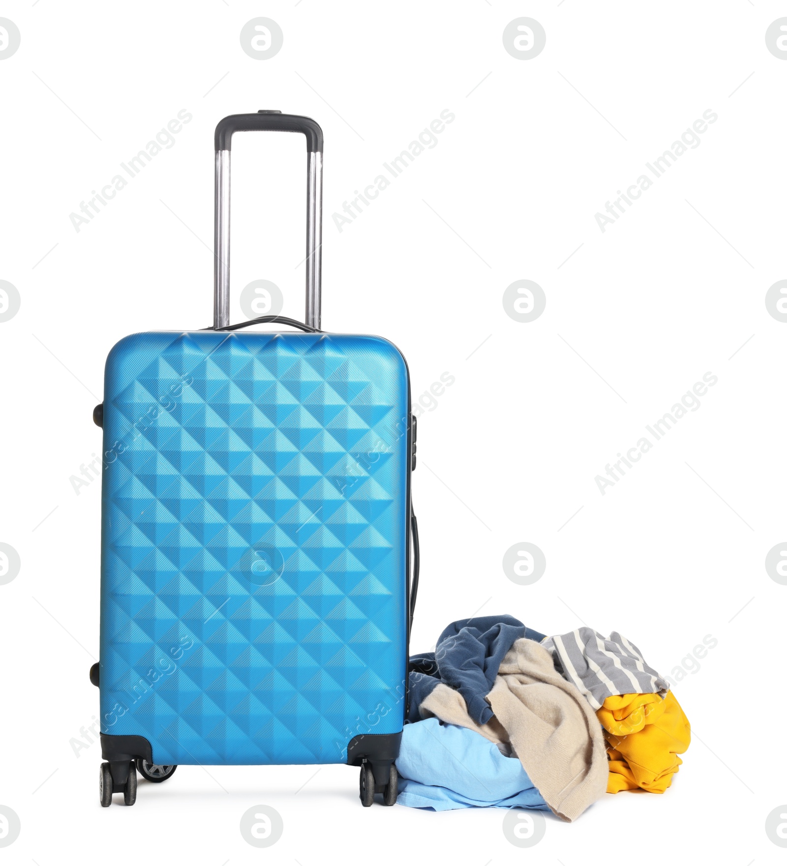 Photo of Suitcase and messy pile of clothes isolated on white