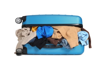 Photo of Packed suitcase full of clothes isolated on white