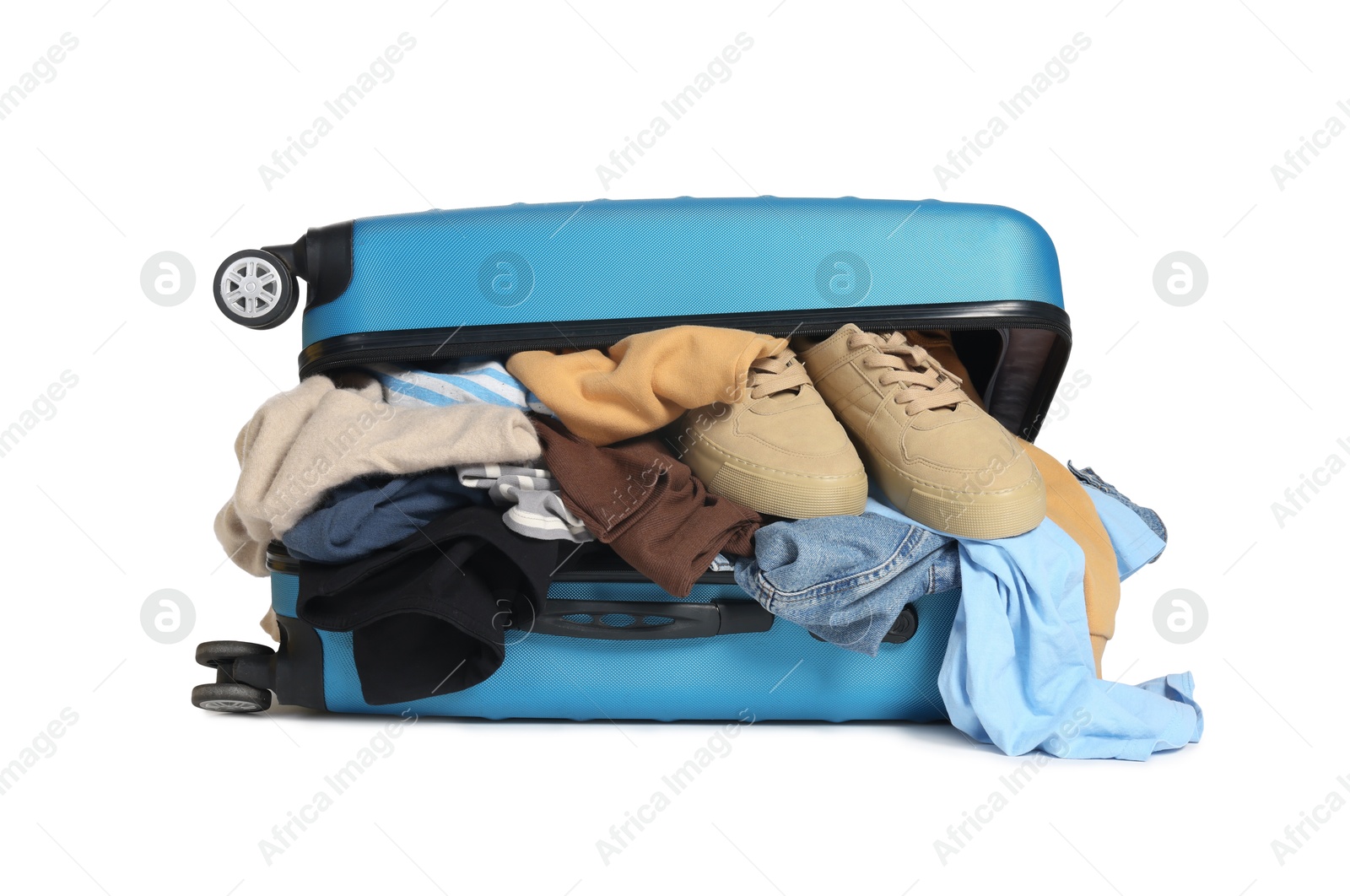 Photo of Packed suitcase full of clothes isolated on white