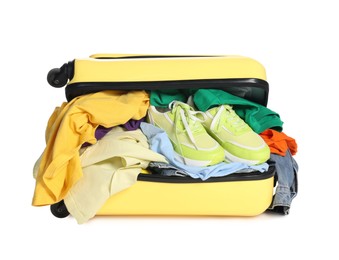 Photo of Packed suitcase full of clothes isolated on white