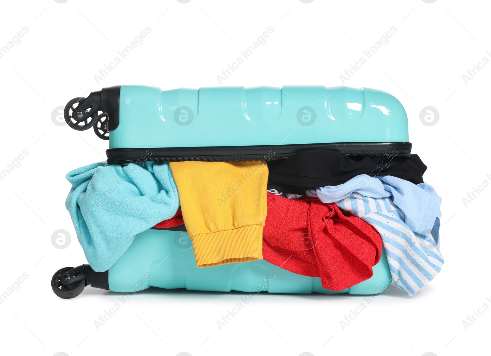 Photo of Packed suitcase full of clothes isolated on white