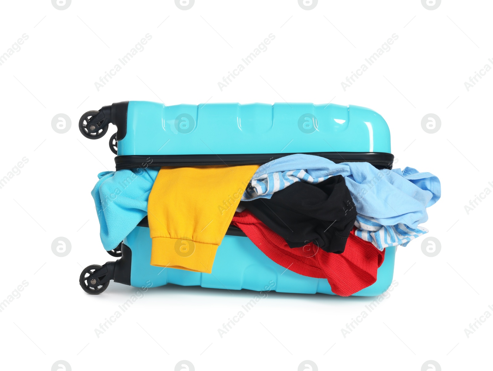 Photo of Packed suitcase full of clothes isolated on white