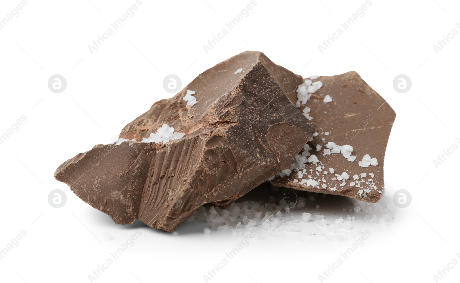 Photo of Pieces of chocolate with salt isolated on white