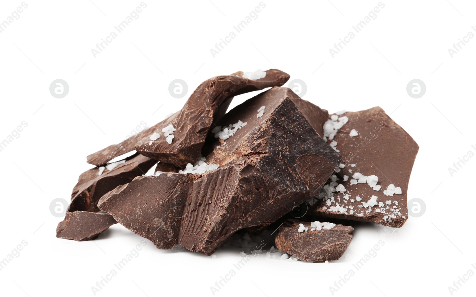 Photo of Pieces of chocolate with salt isolated on white