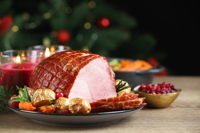 Christmas food. Tasty baked ham served on wooden table, closeup