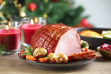 Photo of Christmas food. Tasty baked ham served on wooden table, closeup