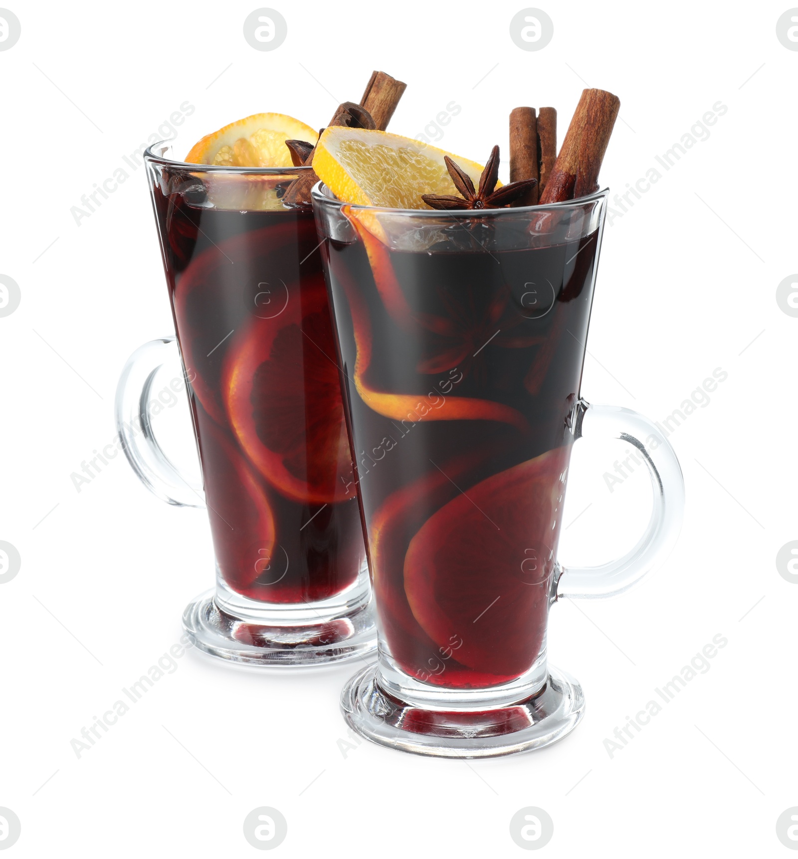 Photo of Tasty mulled wine with orange and spices isolated on white. Christmas drink