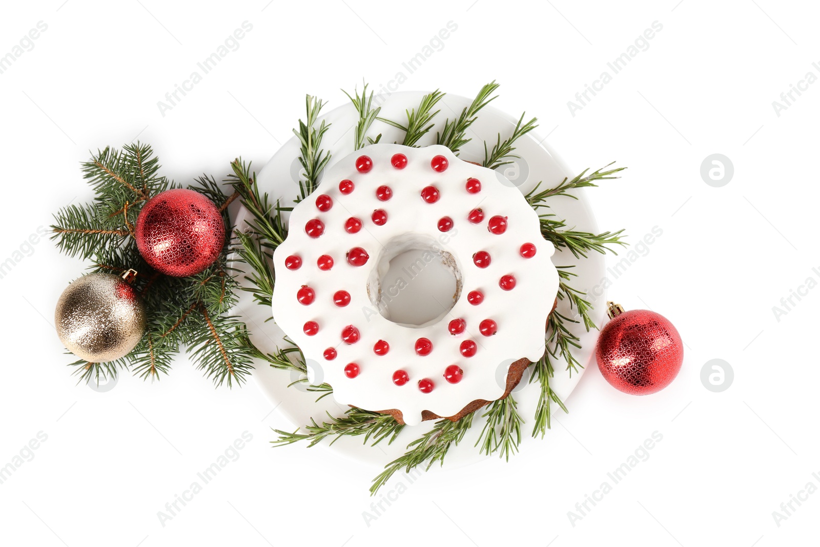 Photo of Beautifully decorated Christmas cake, fir branches and baubles on white background, top view