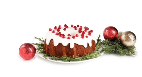 Photo of Beautifully decorated Christmas cake, fir branches and baubles on white background