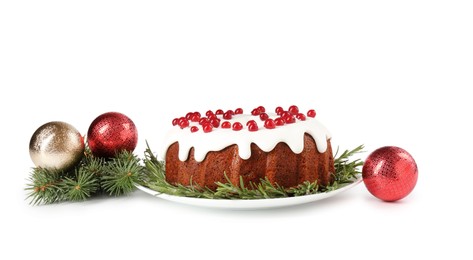 Photo of Beautifully decorated Christmas cake, fir branches and baubles on white background