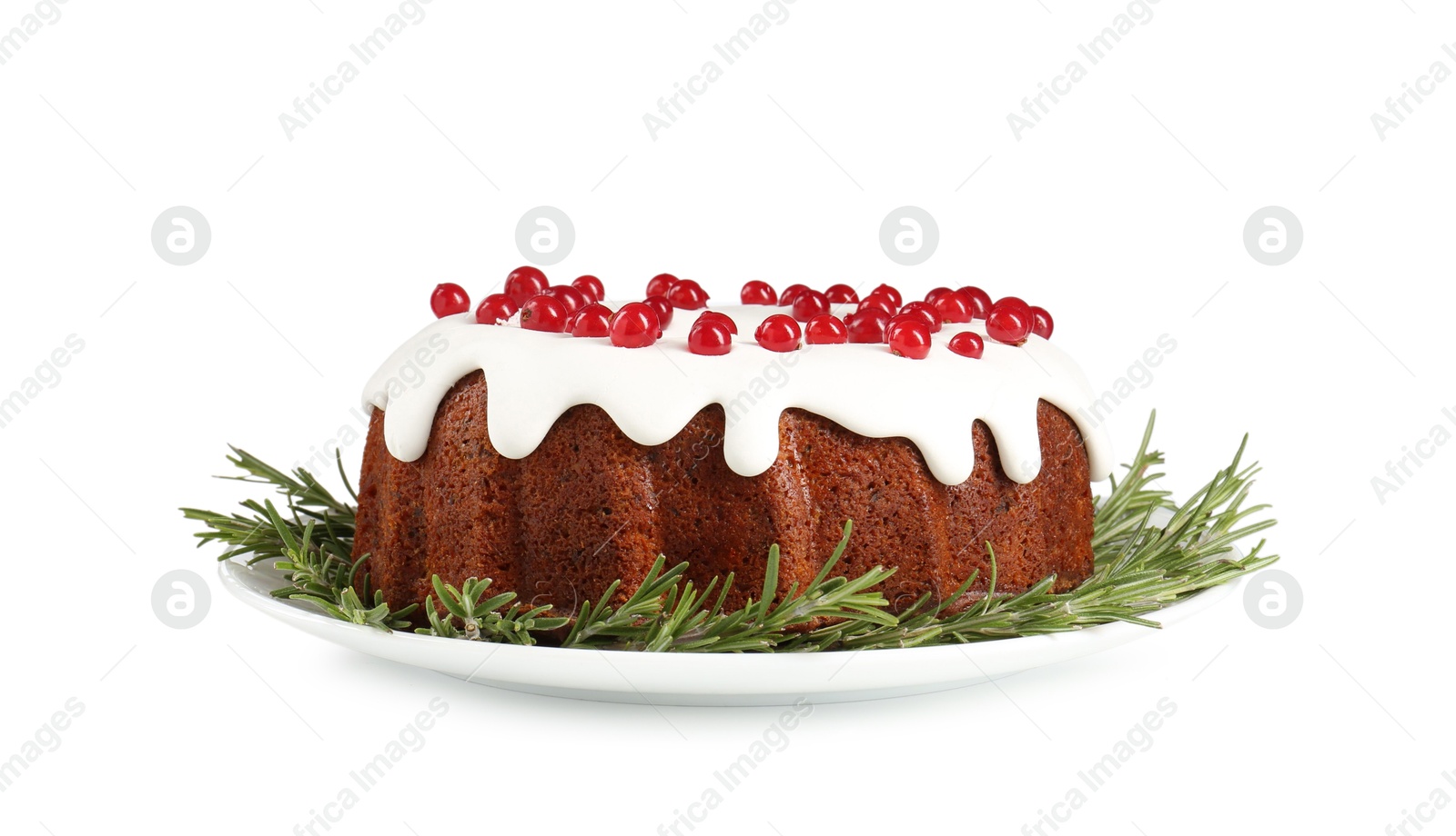 Photo of Traditional Christmas cake decorated with currants and rosemary isolated on white