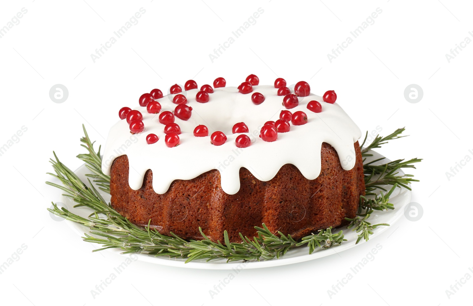 Photo of Traditional Christmas cake decorated with currants and rosemary isolated on white