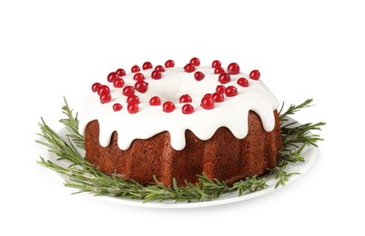 Photo of Traditional Christmas cake decorated with currants and rosemary isolated on white